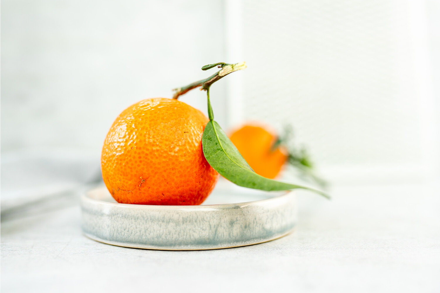 Clementinen mit Blatt